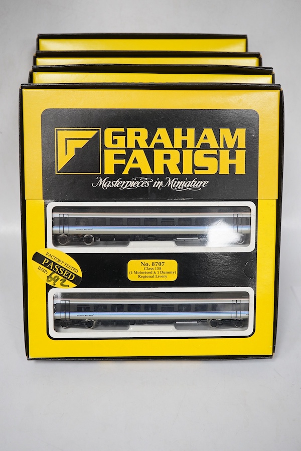 Four boxed Graham Farish N gauge railway train packs; two BR Regional Railways Class 158 2-car DMUs (8707), plus additional 2-car coach set (0887), and a Network SouthEast Class 159 3-car DMU (8748). Condition - good.
